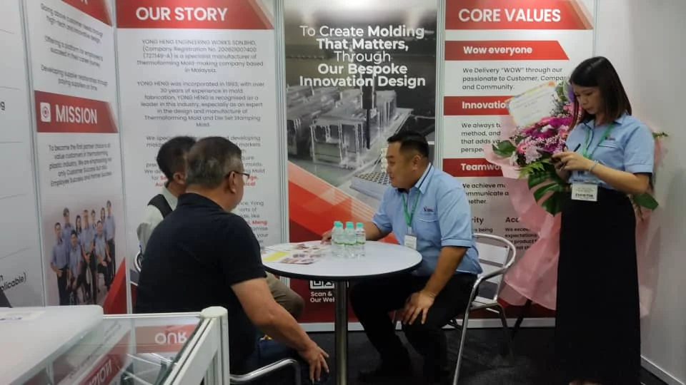 The Yong Heng stand at MITEC Kuala Lumpur, meeting visitors.